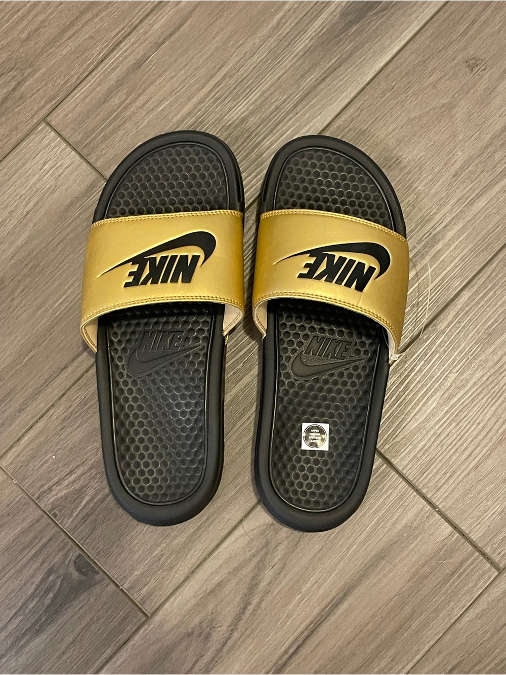 Nike Slides with Gold Upper and Black Sole